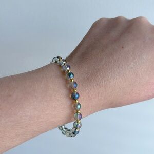 25.  Angel aura quartz and hematite size 7 or smaller